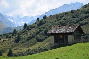scenic landscape, old hut on meadow at Alm Mountain, austria
