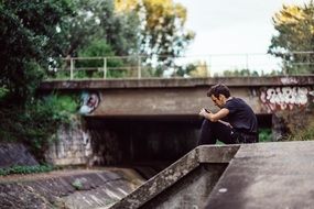 young photographer on a concrete slab