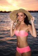 girl in a bathing suit and hat