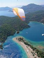 Paragliding over scenic coastal landscape