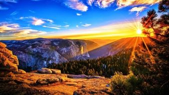 landscape of tableau of bright sunrise over the mountains