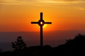 Cross on summit at sunset sky, germany, Zittau Mountains Nature Park