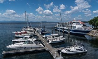 ship at coast, motor and sailing boats at pier on Lake Champlain, usa, Vermont, Burlington