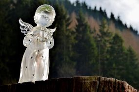 Glass angel figurine among the plants in Luxembourg