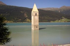 tower in water at reschen pass