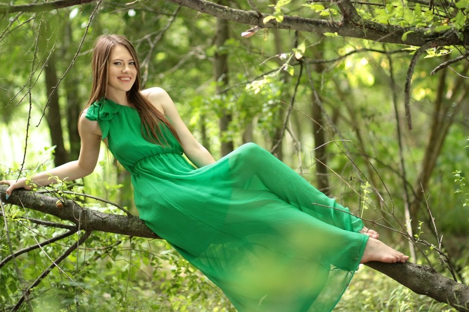 girl in the green dress in the forest