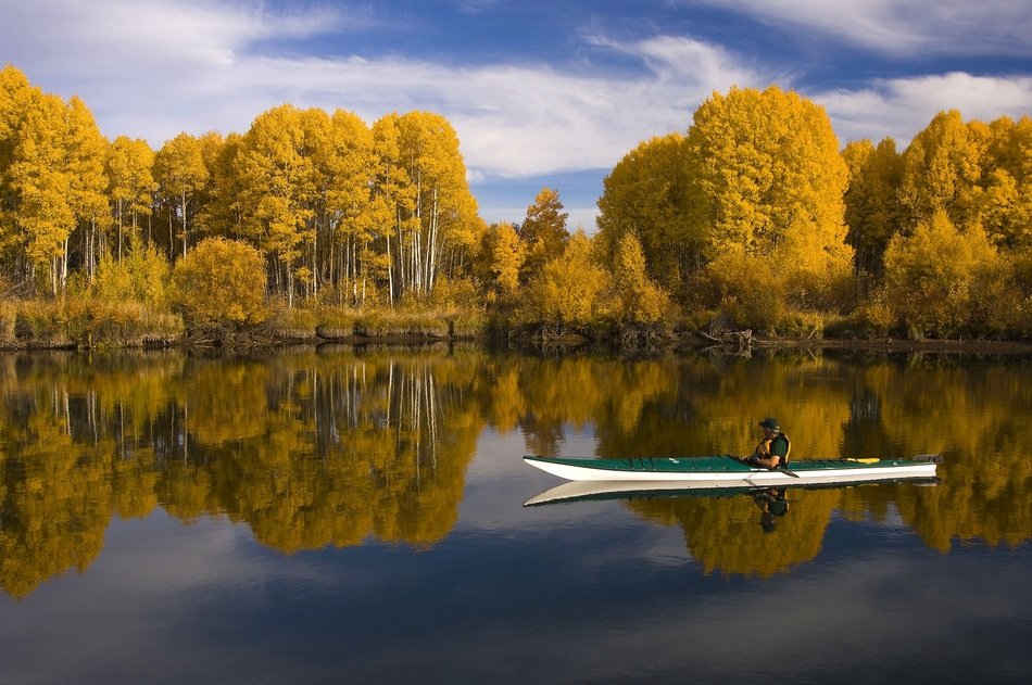 kayak on the mirror lake in autumn