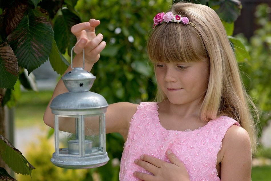 blond child with a lantern