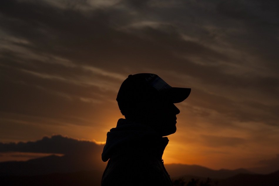 Silhouette of the man and sunset