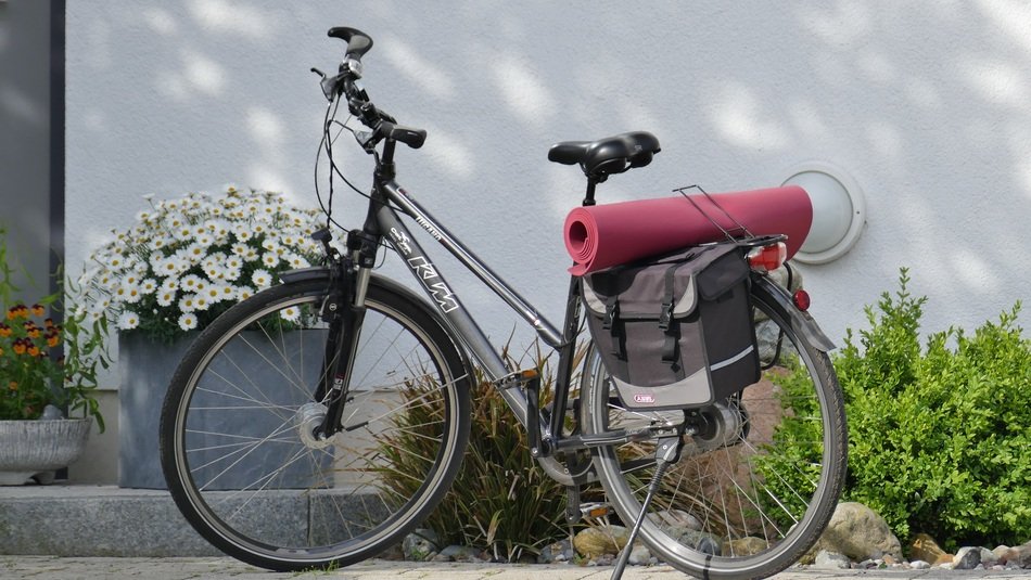 Yoga Mat fixed on bicycle at wall