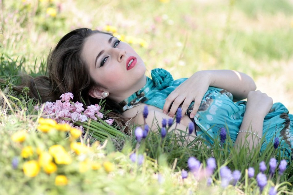 beautiful model on the spring meadow