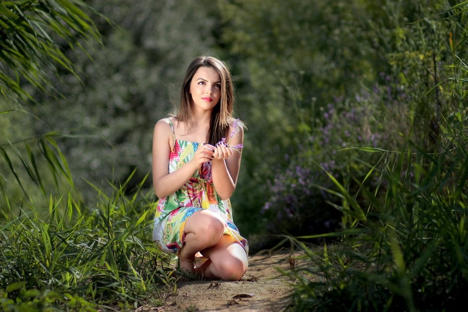 model posing in the green