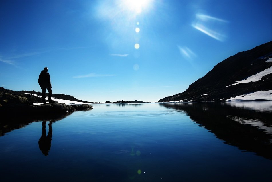 man near a mountain lake