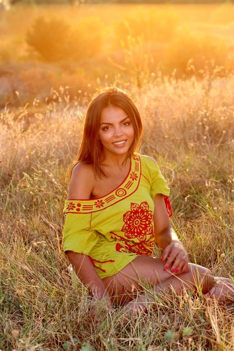 smiling beautiful girl in the sunset light