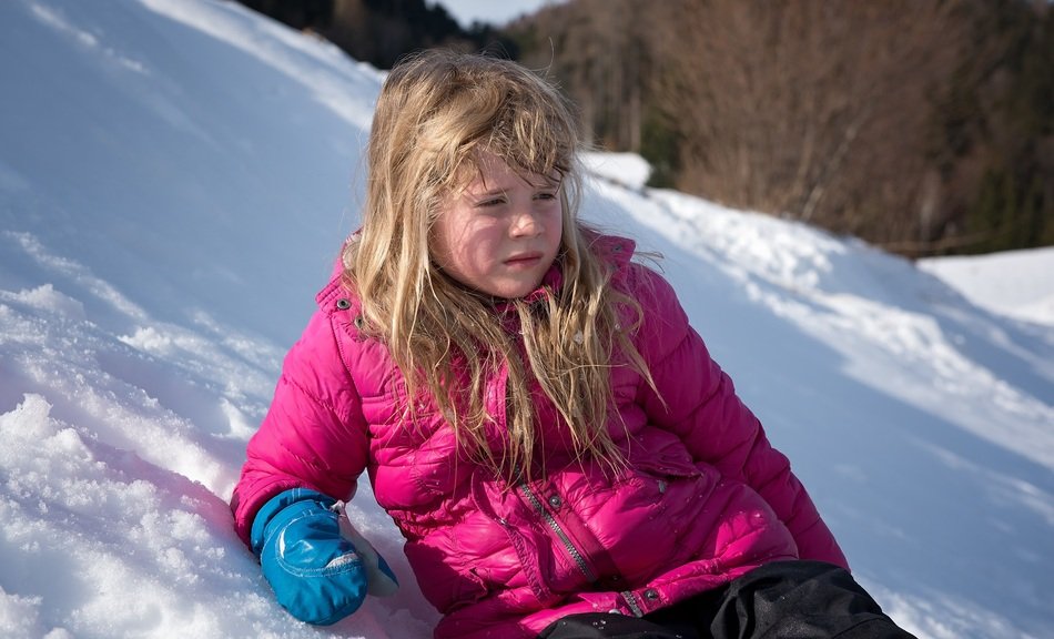 Girl on the snow in winter
