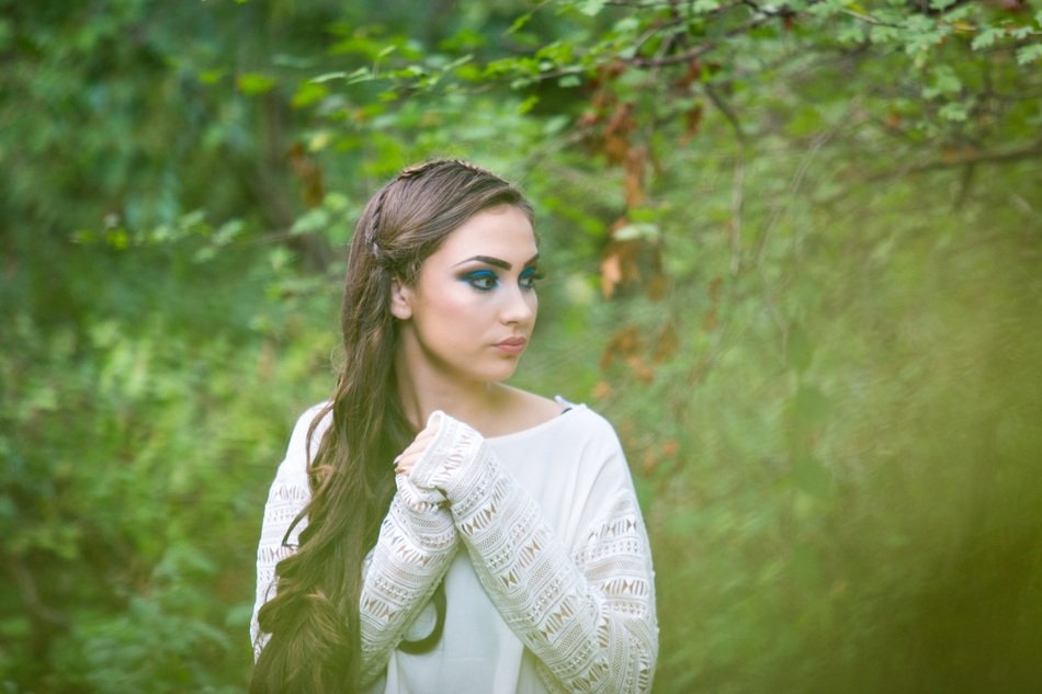 portrait of a long haired lady in forest