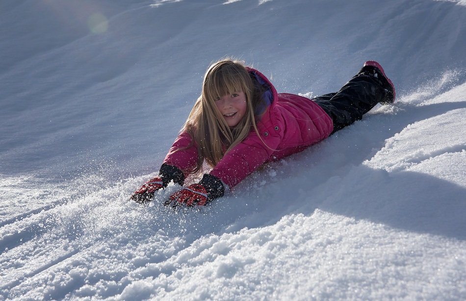 girl in the pink jacket in the snow