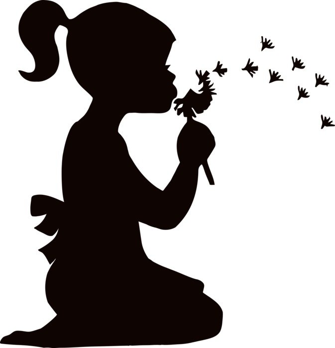 silhouette of a girl blowing on a dandelion