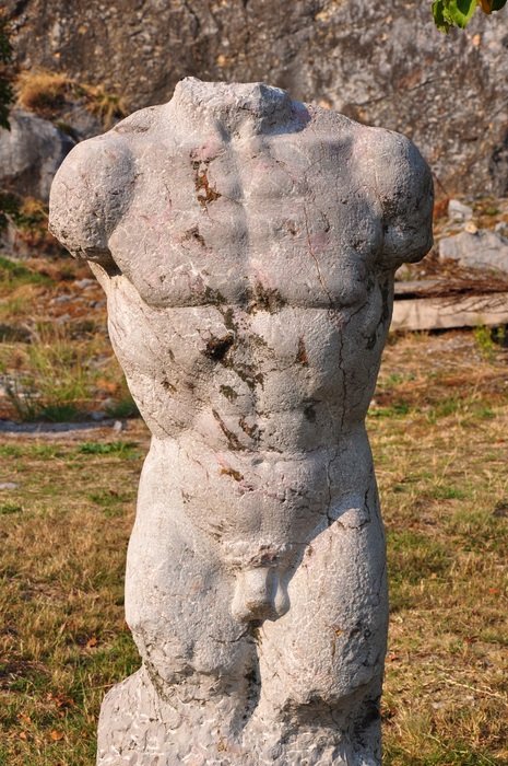 headless stone garden sculpture