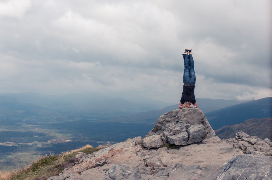 yogi on top of a mountain in Scotland