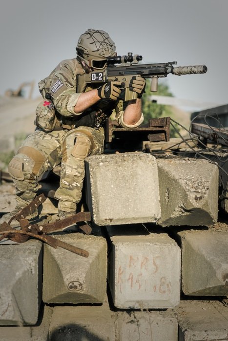 soldier with weapon in the line of fire