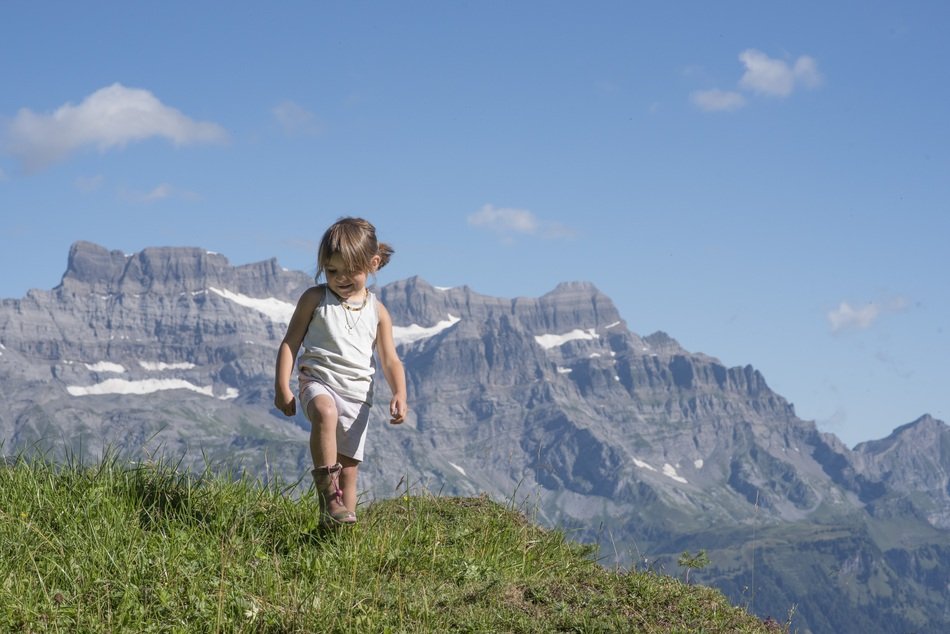 Child girl on the beautiful Alp Canton Of Glarus in Switzerland
