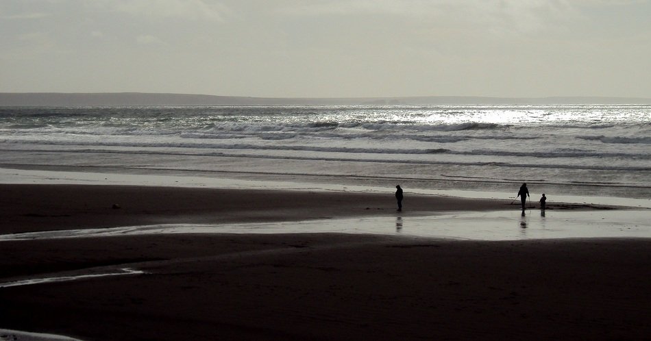 People on the beach in autumn