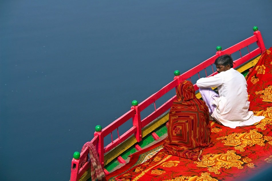 people by the river, India