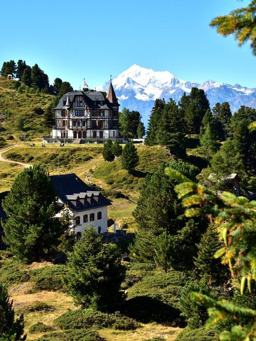photo of luxury mansions in the mountains in Switzerland