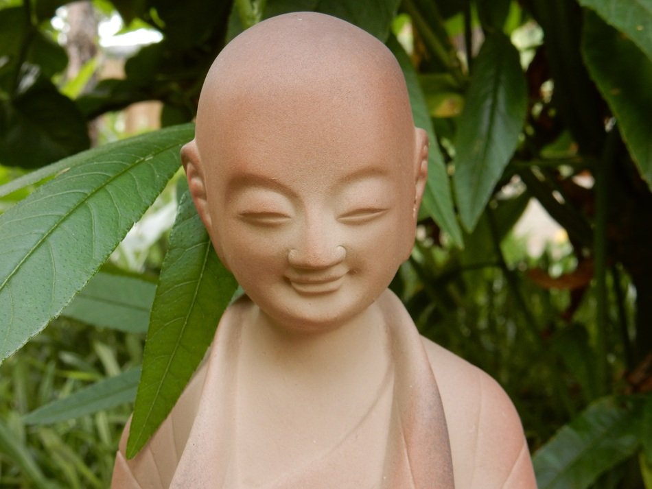 Buddhist statue on the background of greenery in China