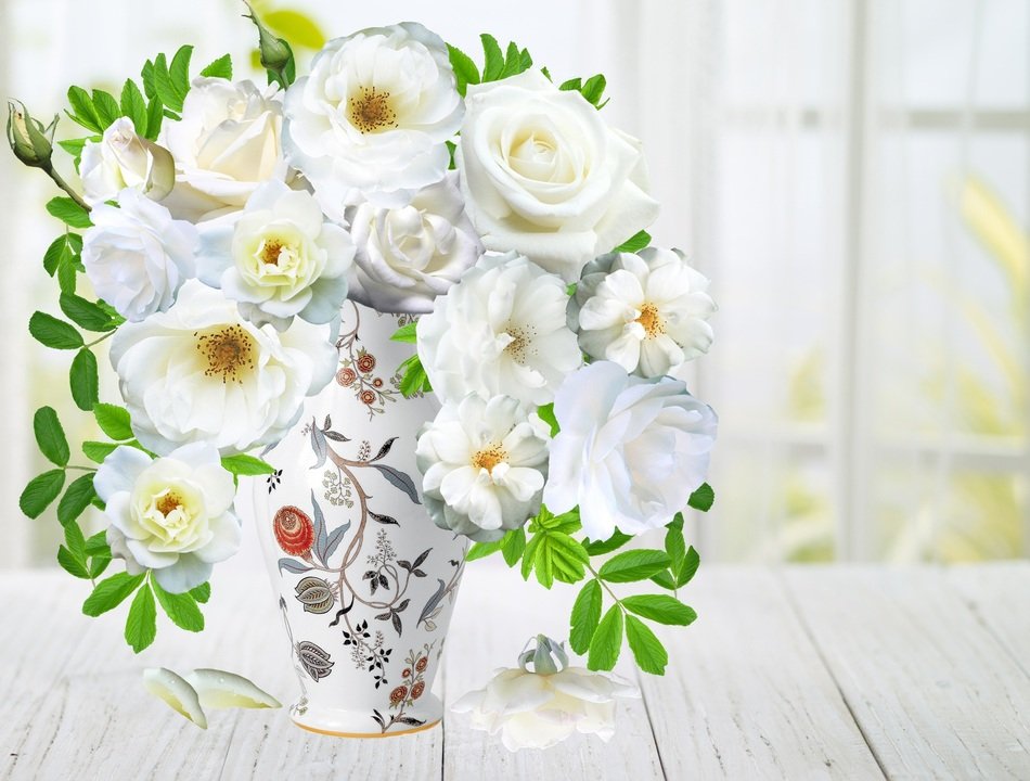 white roses in a ceramic vase