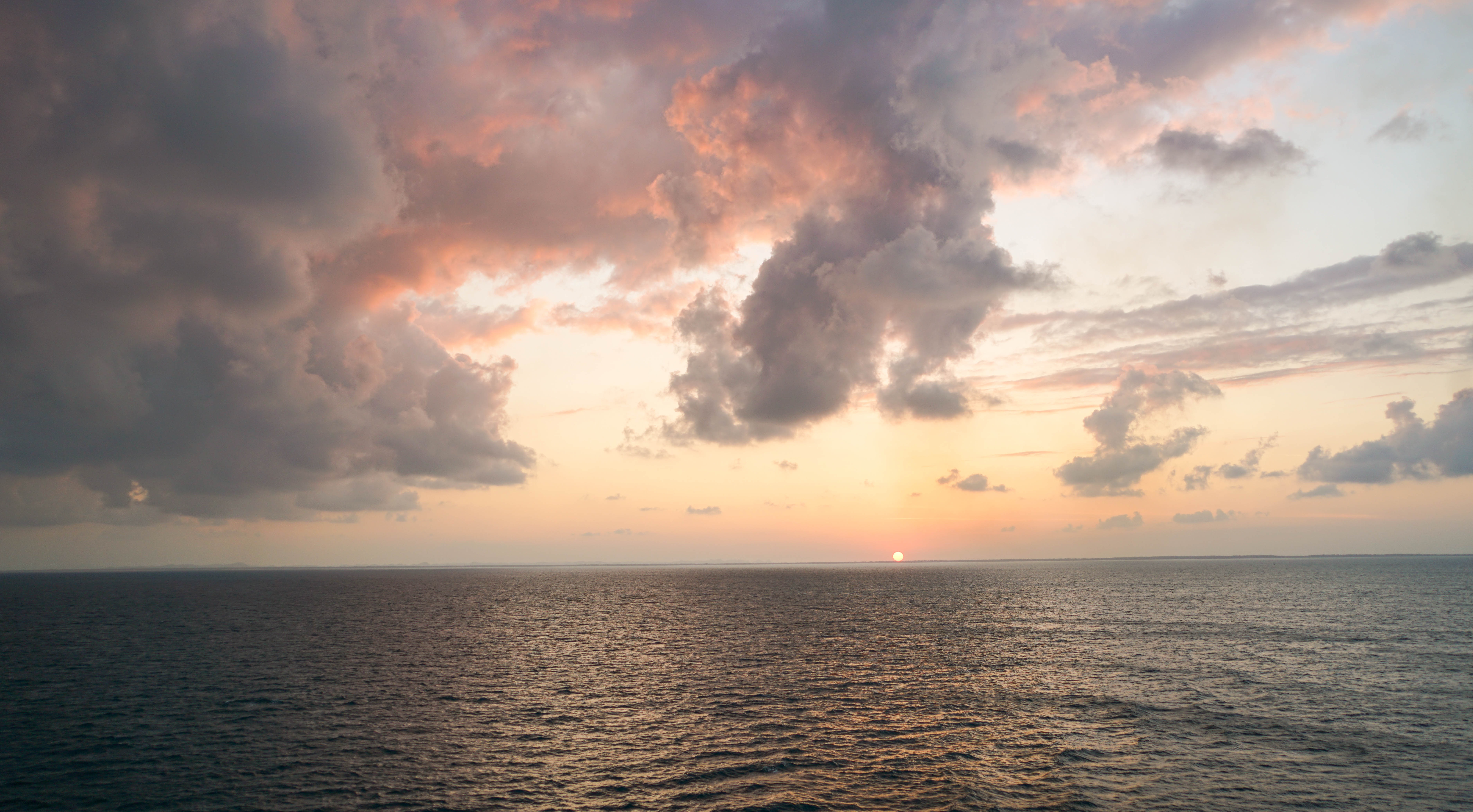 Sunset Cloudy Sky Over The Ocean Free Image