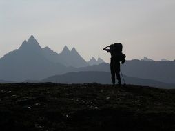 Silhouette of the hiker on the mountains