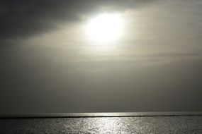 sun shining through the clouds over the north sea