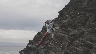 landscape of photographer on rock at evening