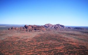 Olgas of Kata Tjuta, group of large, domed rock formations in desert landscape, australia