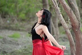brunette young woman in the forest