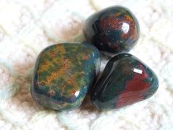 three natural green stones