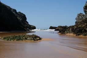 rocky coast on a sandy beach in corsica