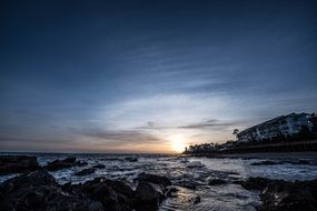 Distant view of the setting sun over the coast of Spain