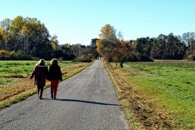 People walking away at autumn season