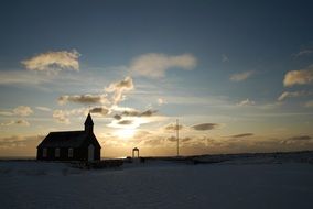 church on the background of the winter landscape at sunset in Iceland