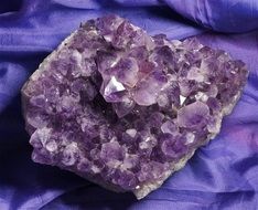 purple amethyst on purple fabric