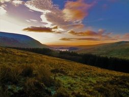 cloudy sunrise over pen-y-fan peak in wales