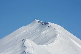 snowy mountain summit at sky