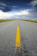 Yellow markings on the long road