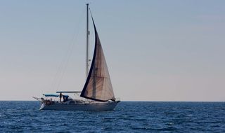 boat with sails at sea