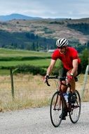 uniform cyclist rides on the road, canada, competition