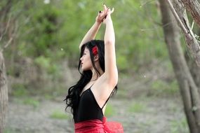 Beauty dancing girl in a forest