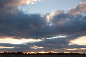 dark clouds in the blue sky